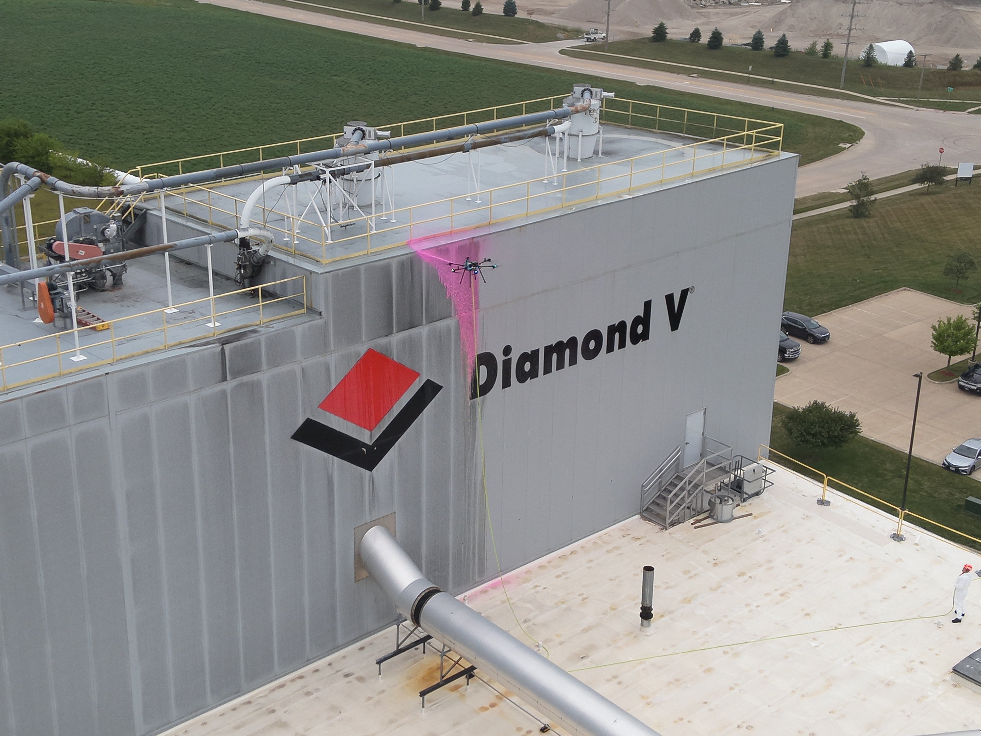 Industrial facility exterior cleaning by drone