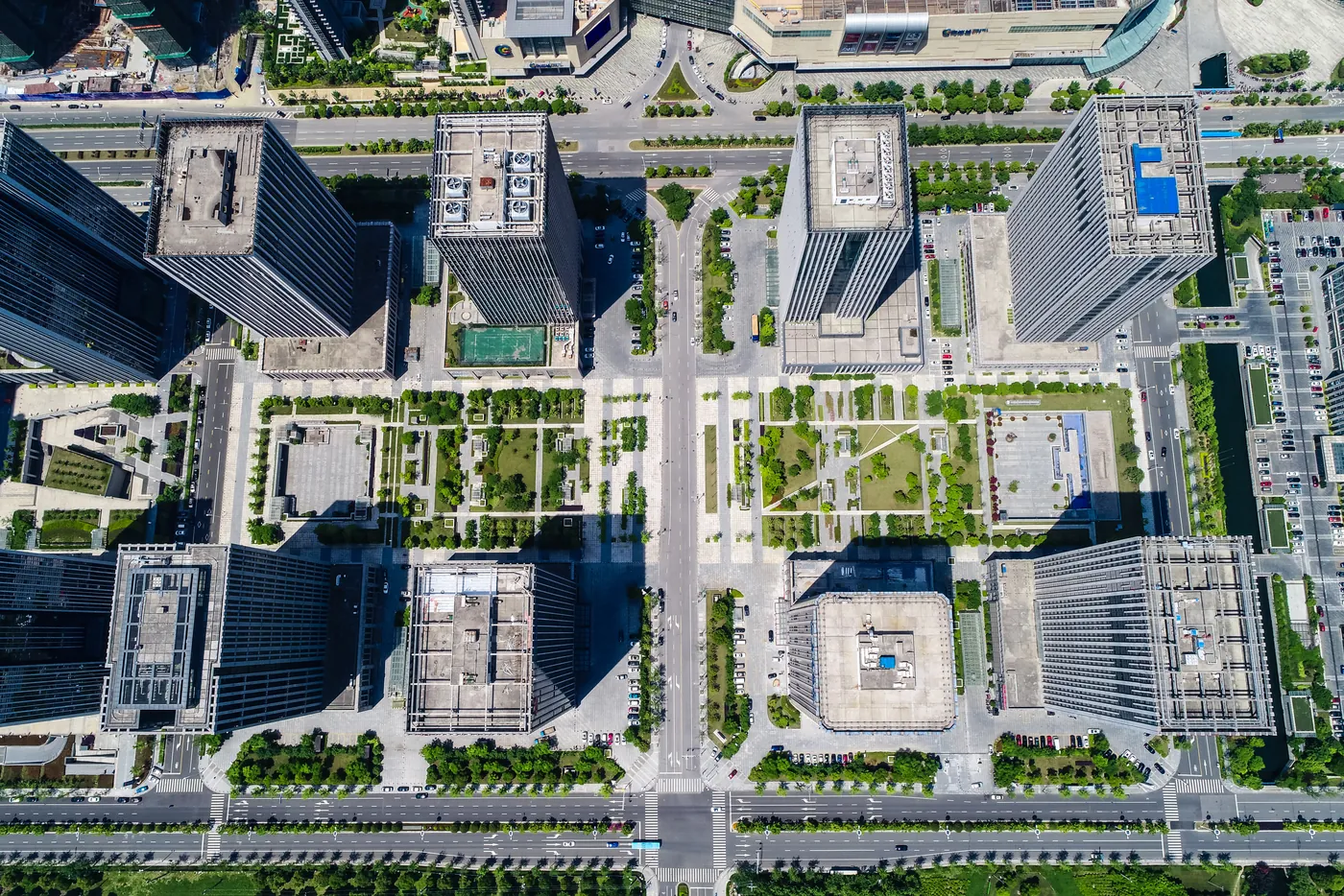 Overhead aerial drone view of commercial buildings and rooftops for property inspection