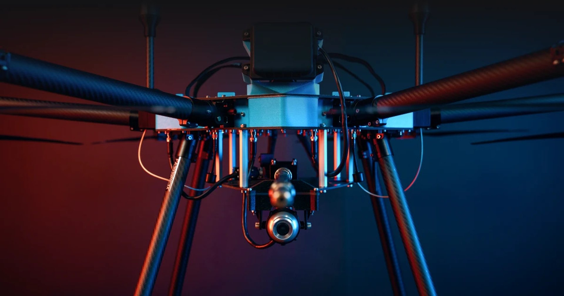 Industrial cleaning drone washing a high-rise facade from ground level